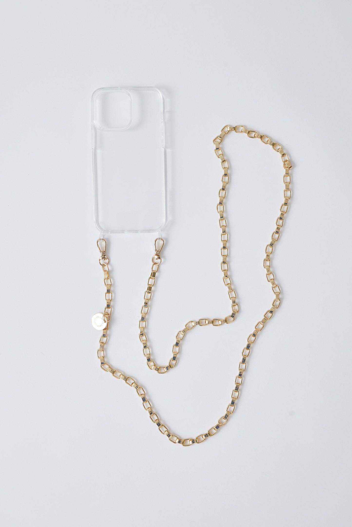 Detachable gold phone chains with clear phone case, stylish and functional design.