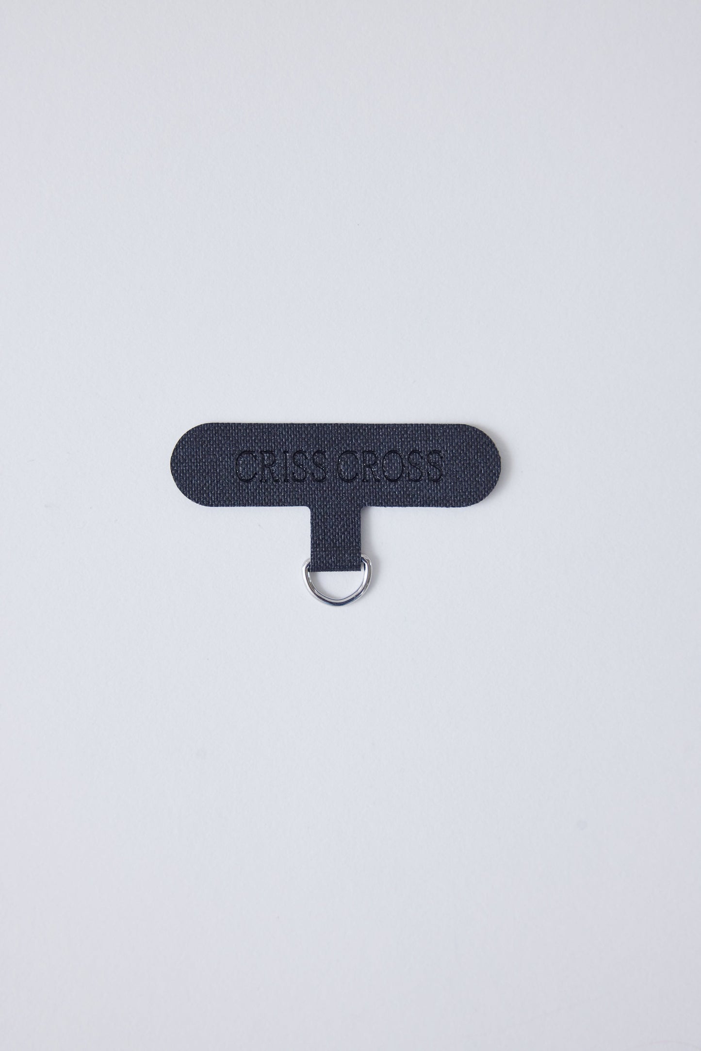 Single universal phone adapter in black with attachment ring.