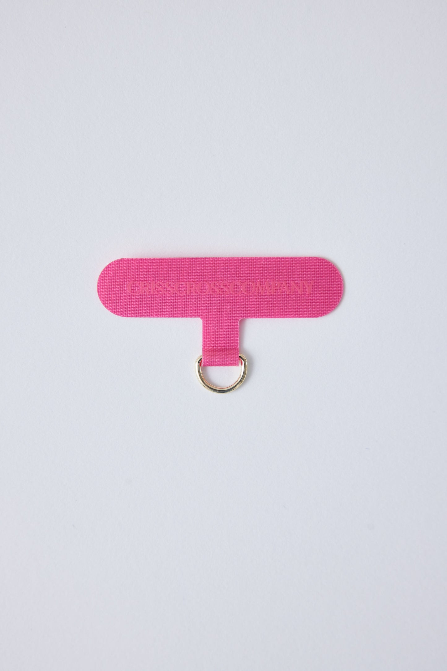 Single Universal Phone Adapter in pink with a D-ring for securing with straps or chains.