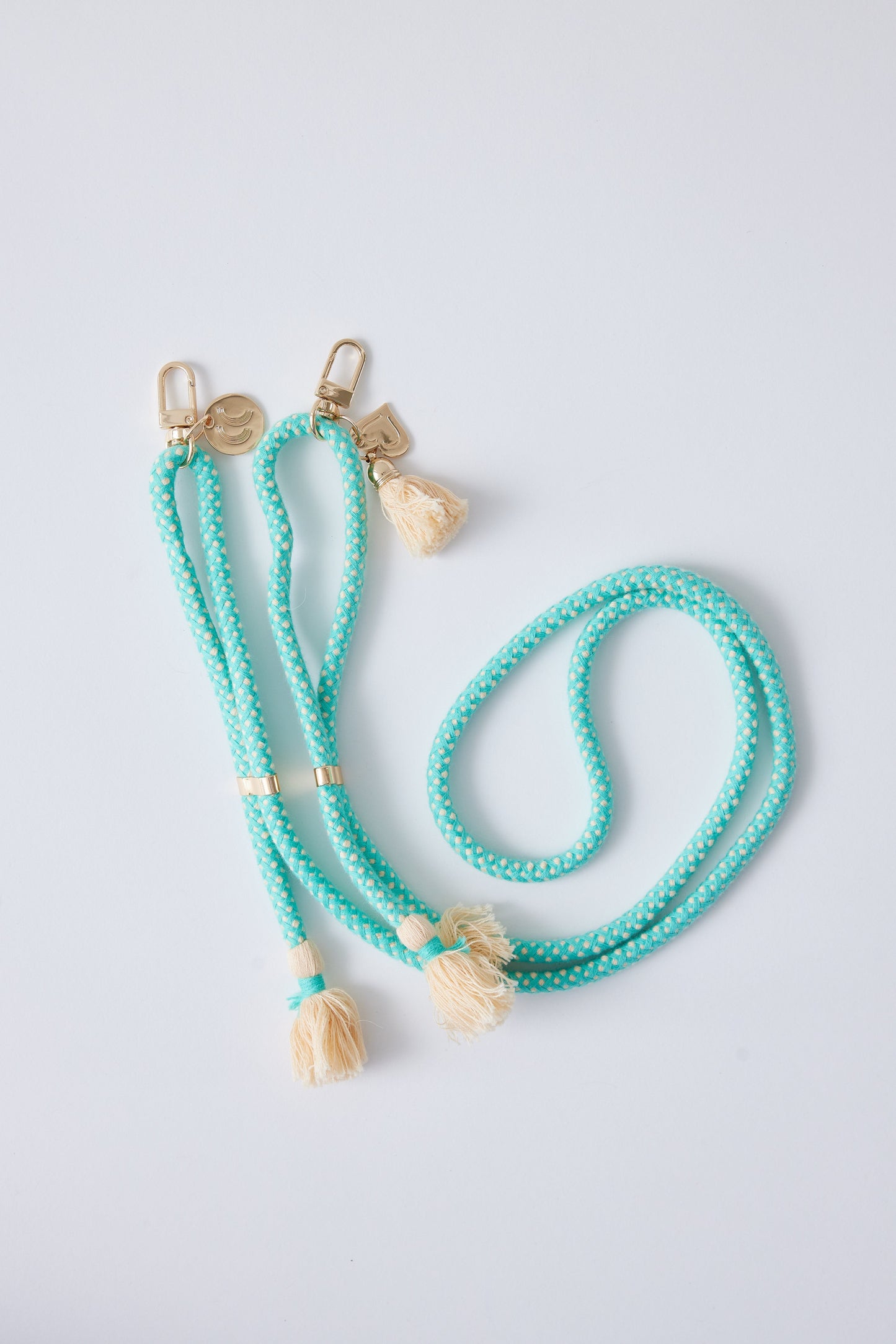 Cotton phone straps with double carabiners, detachable, featuring tassels and a heart charm, adjustable and 60 inches long.