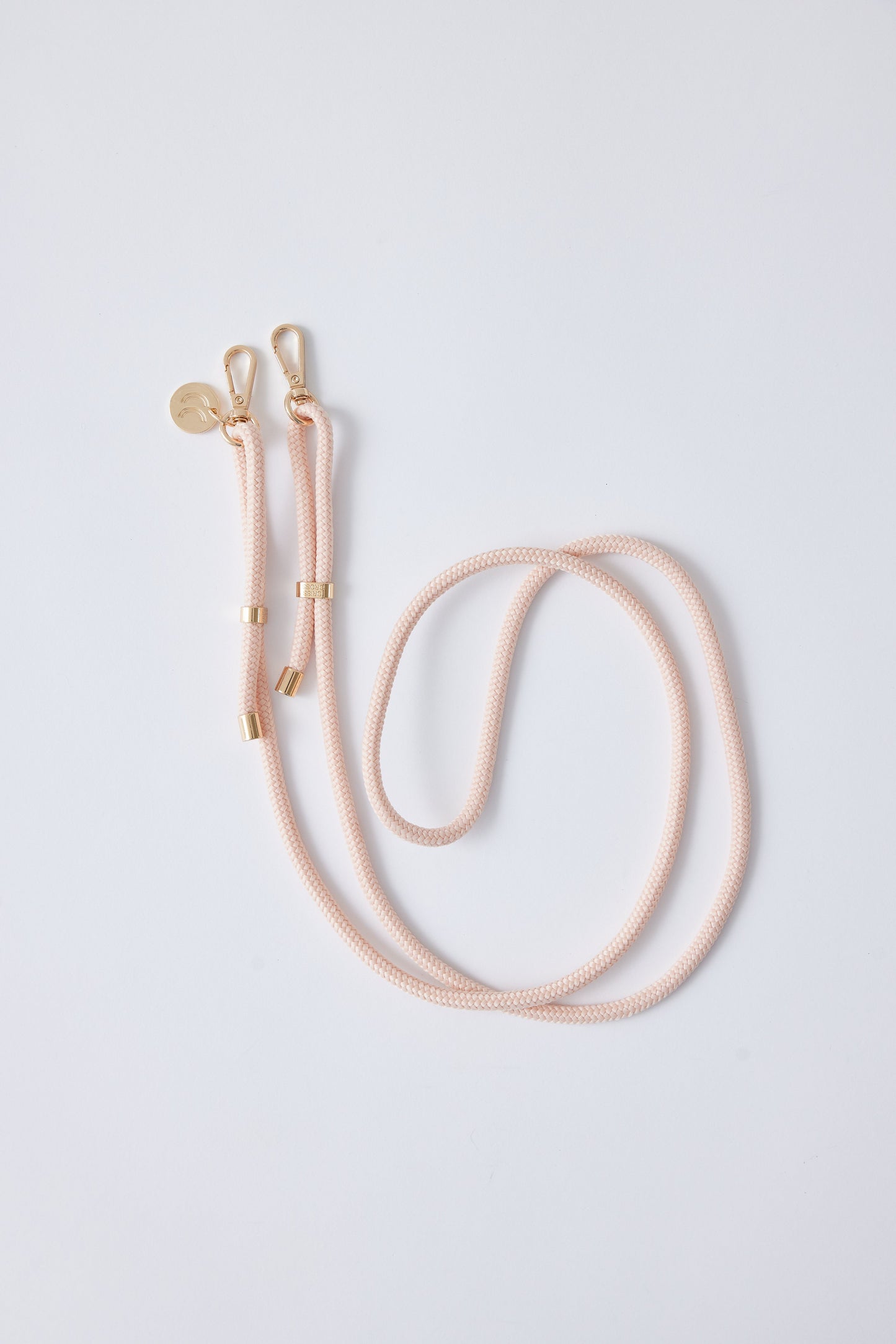 Detachable Poly Straps in pink with gold carabiners, made of polyester, adjustable and approx. 60 inches long.