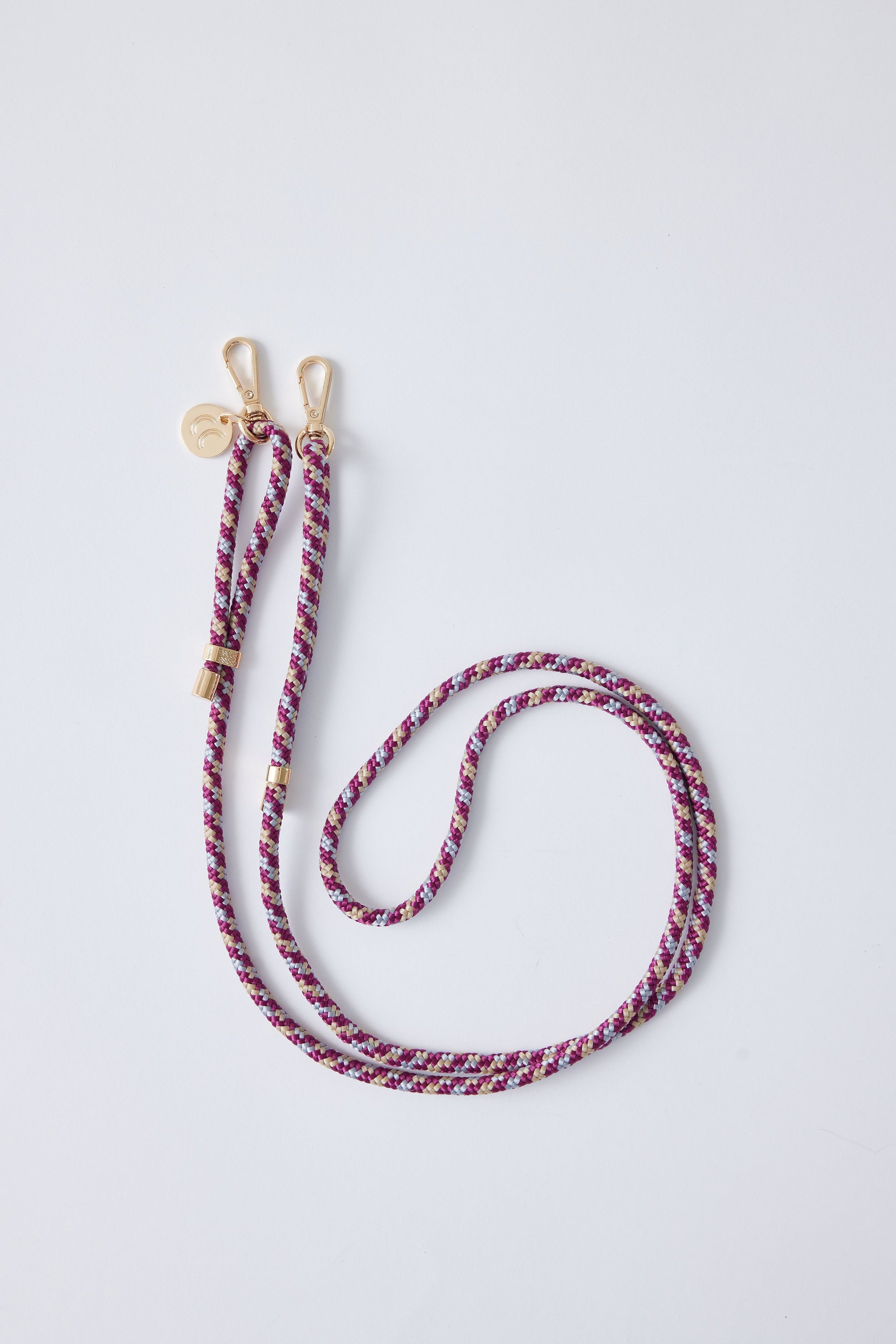 Detachable Poly Straps in Camouflage with gold carabiners, polyester material, 60 inches long, adjustable.