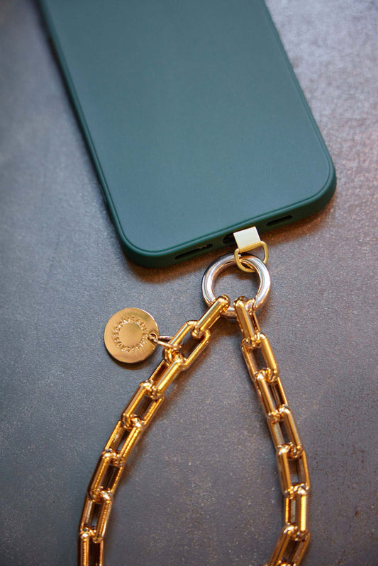 Gold Wristlet Ava attached to a green phone, showcasing stylish phone jewelry accessory.
