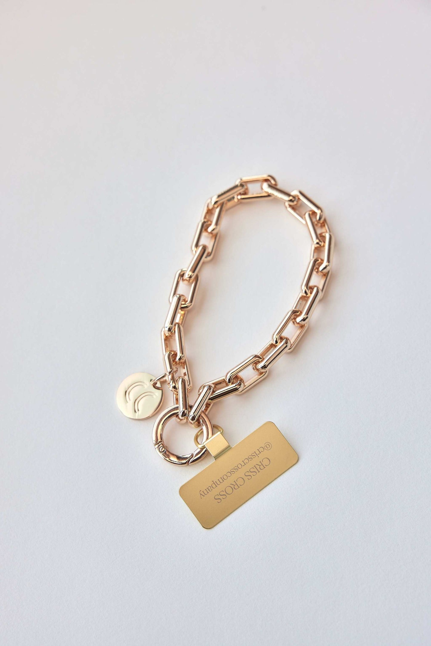 Gold Wristlet Ava with Universal Patch, stylish phone accessory with chic design.