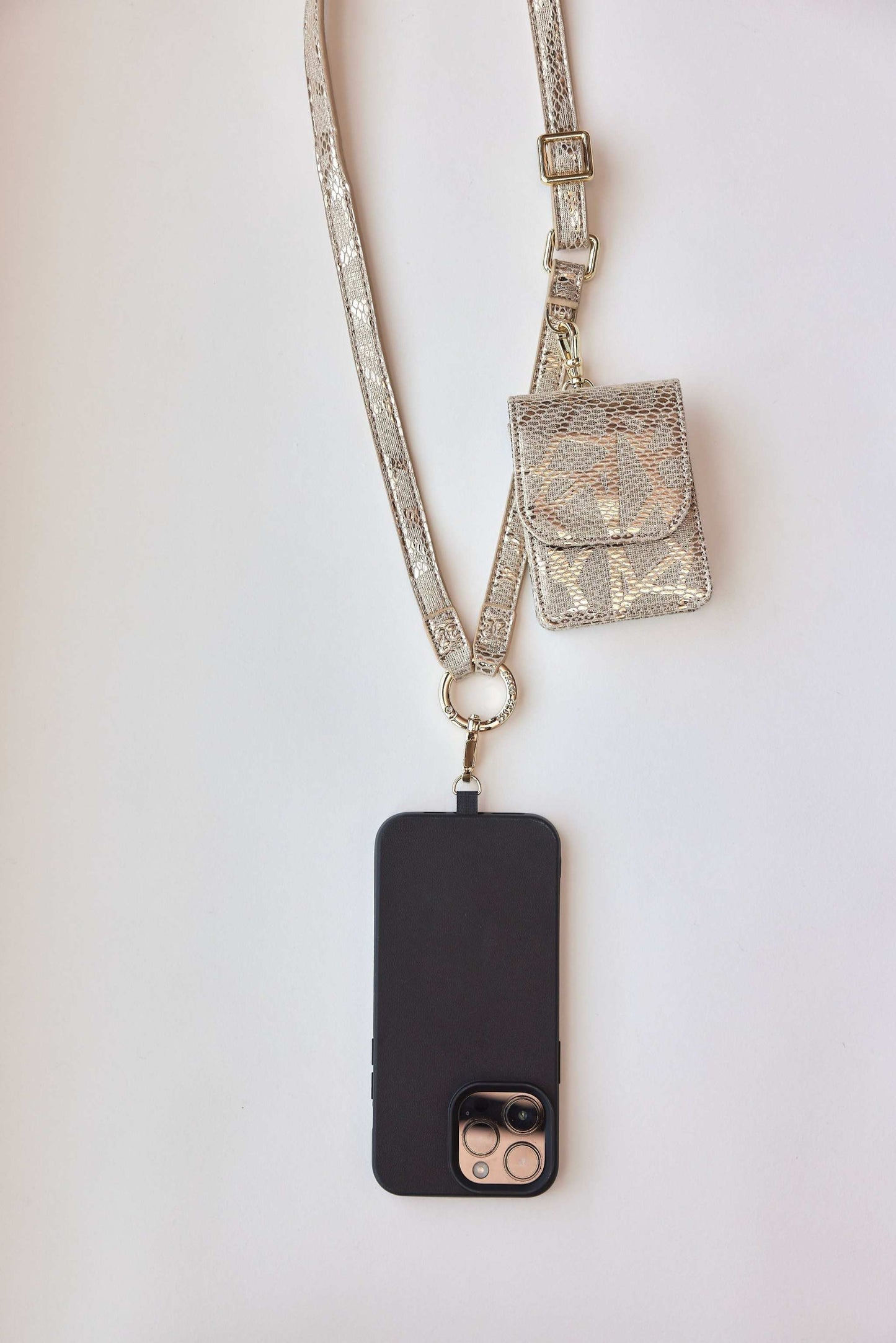 Cobra vegan leather phone strap with clip wallet and holder, chic snake texture.