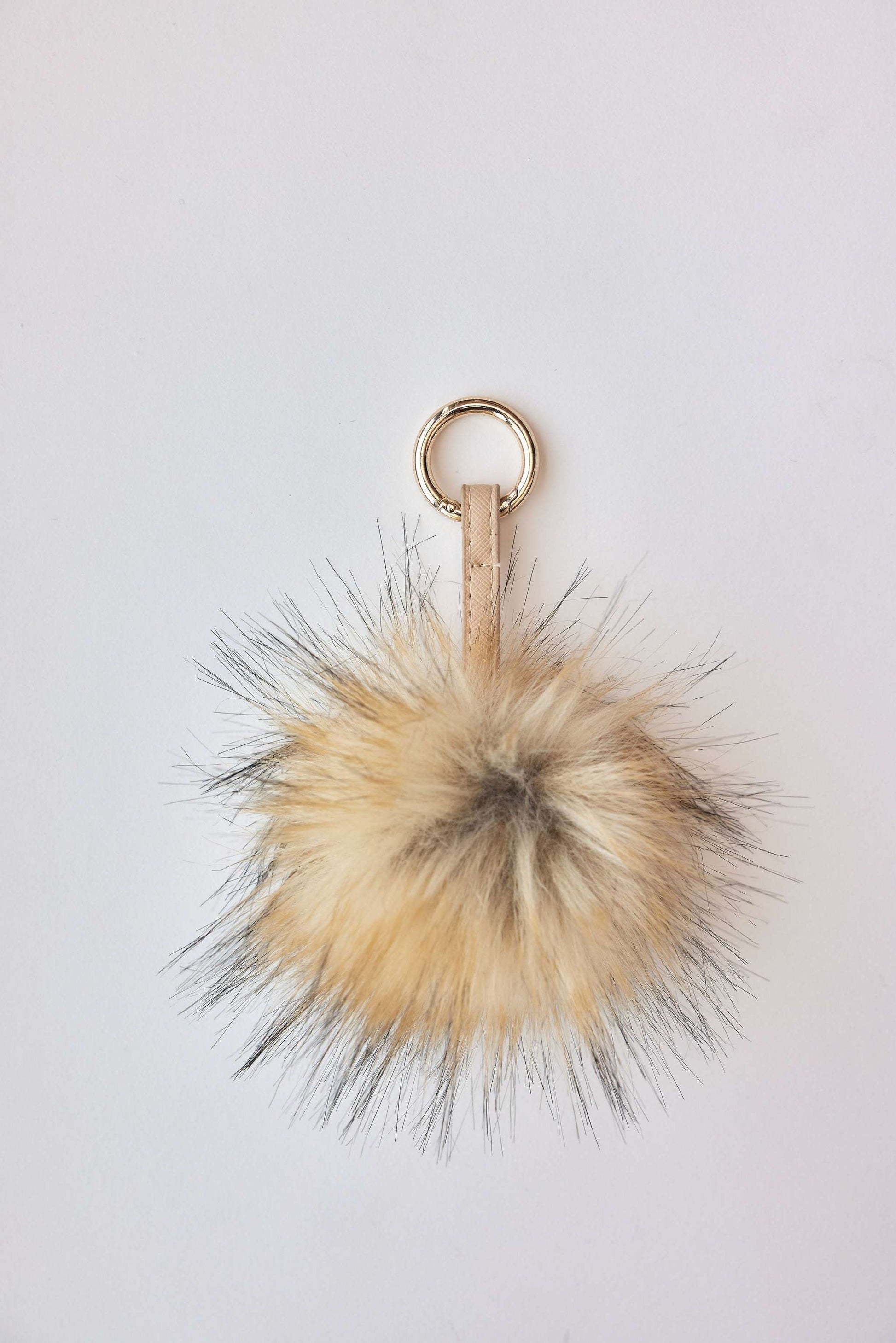 faux fur pom-poms accessory keychain in beige with metal loop