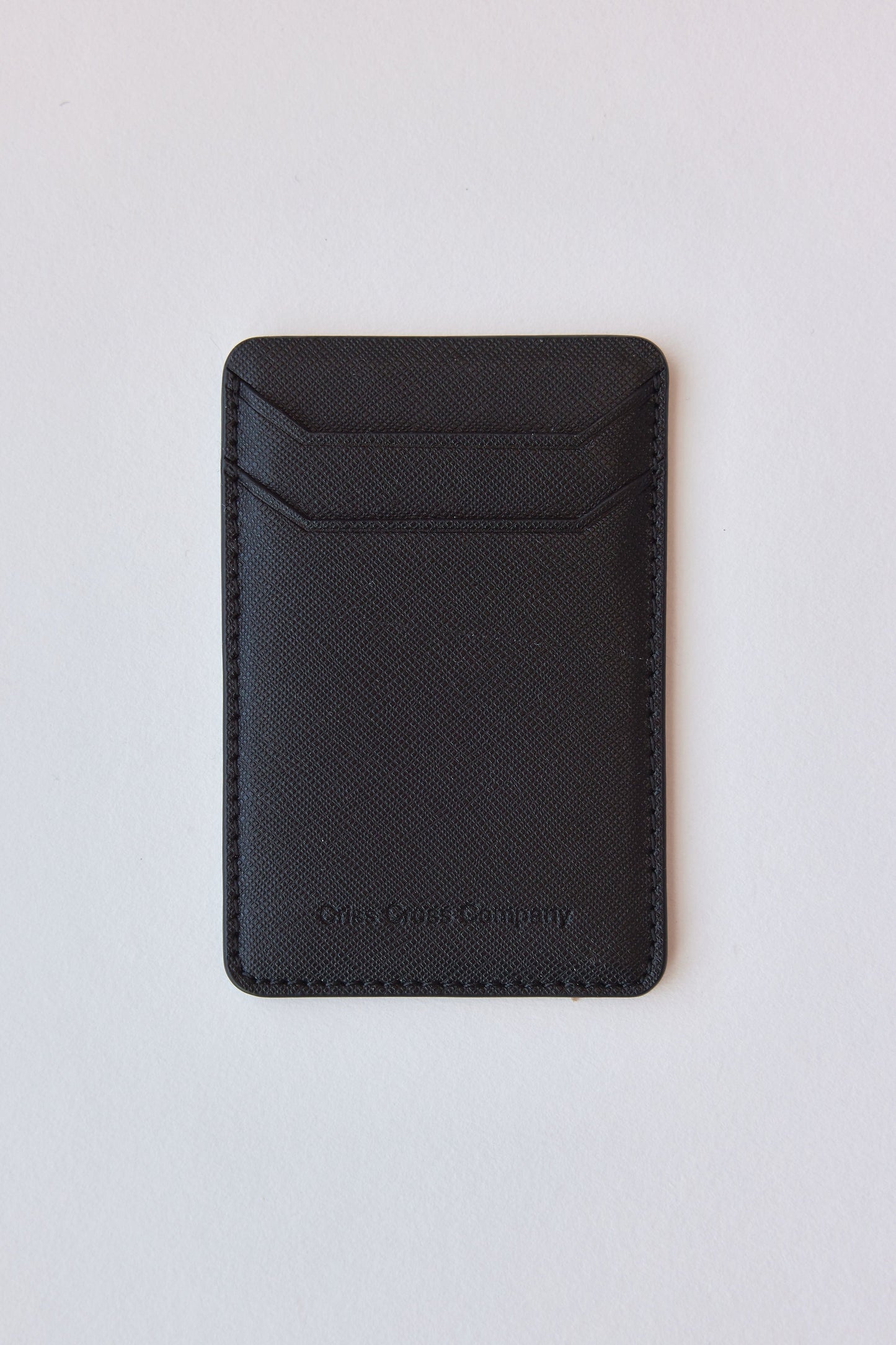 Sticky vegan leather phone wallet with two card slots.