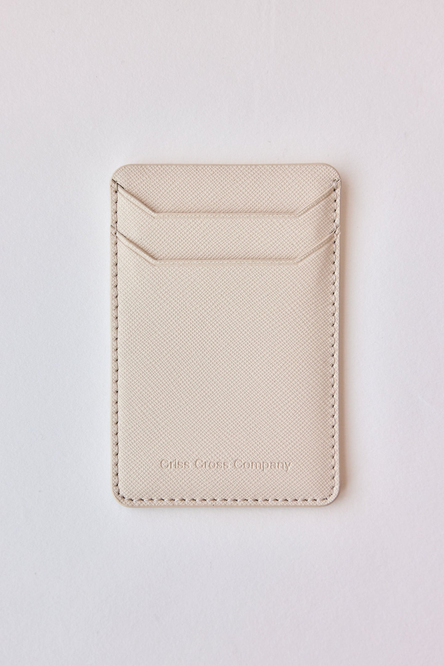 Sticky vegan leather phone wallet with two divided card slots.