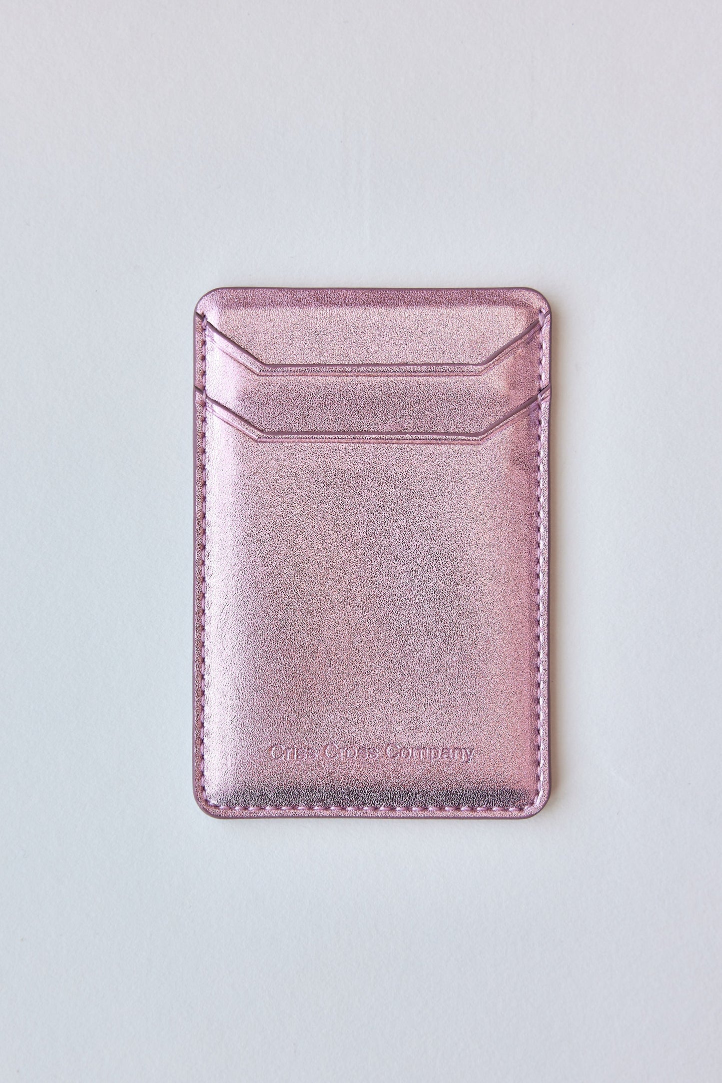 Sticky vegan leather phone wallet with two slots for cards, slim design.