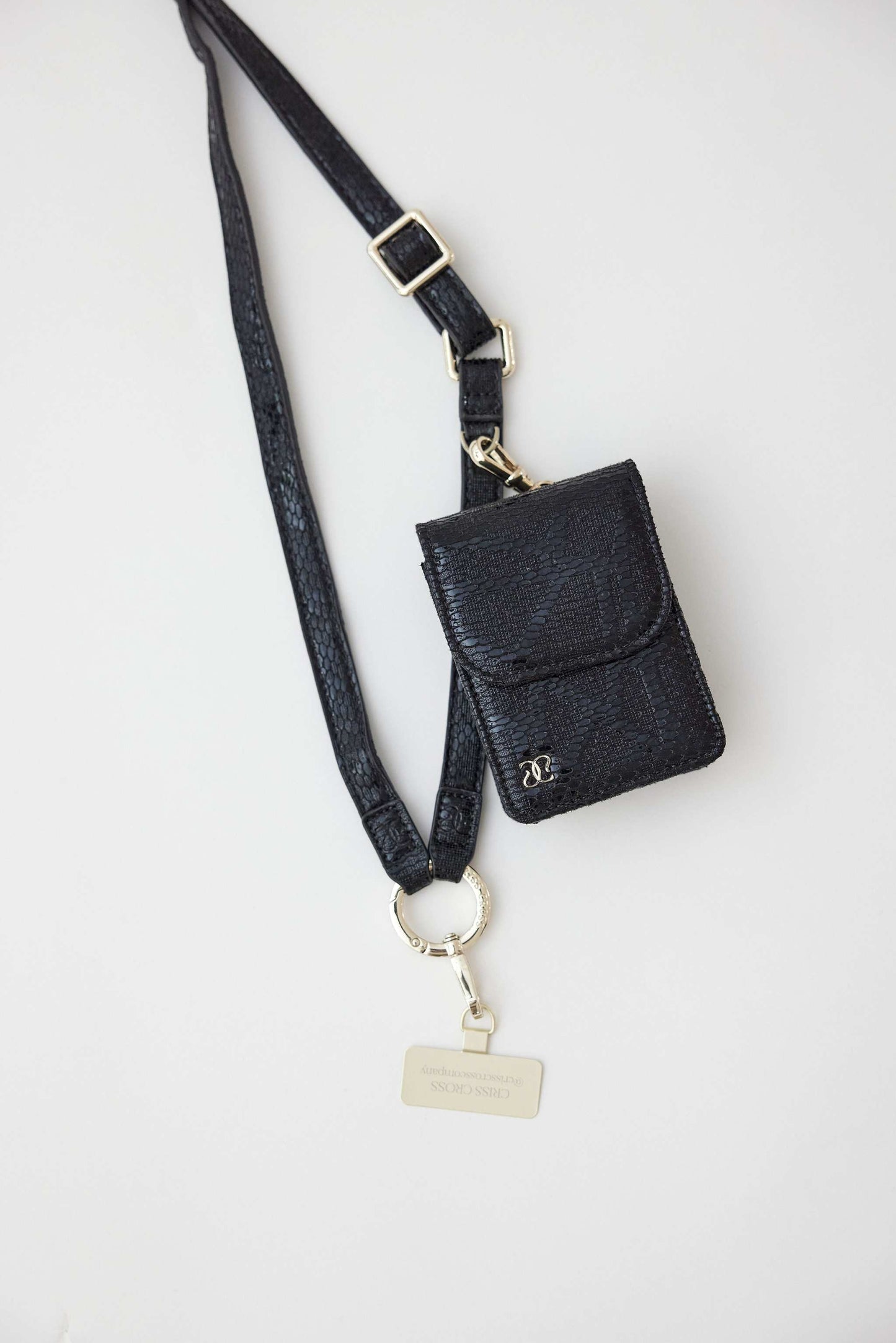 Cobra vegan leather strap with clip wallet and phone holder in black.