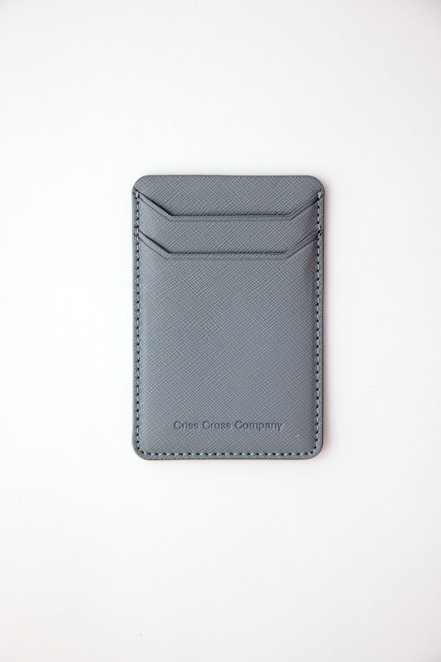 Sticky vegan leather phone wallet with dual card slots.