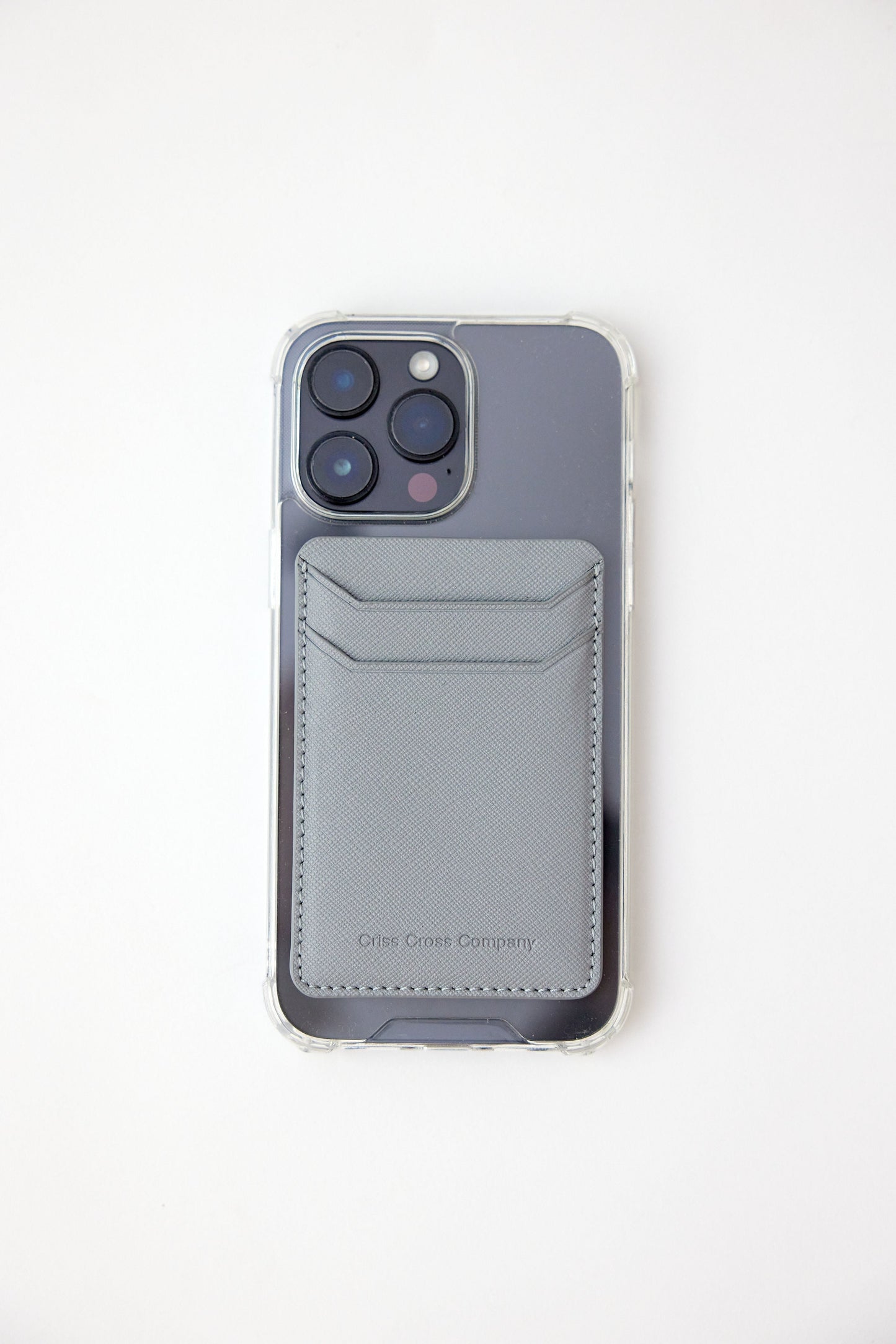 Sticky Vegan Leather Phone Wallet attached to smartphone, featuring slim design with two divided card slots.
