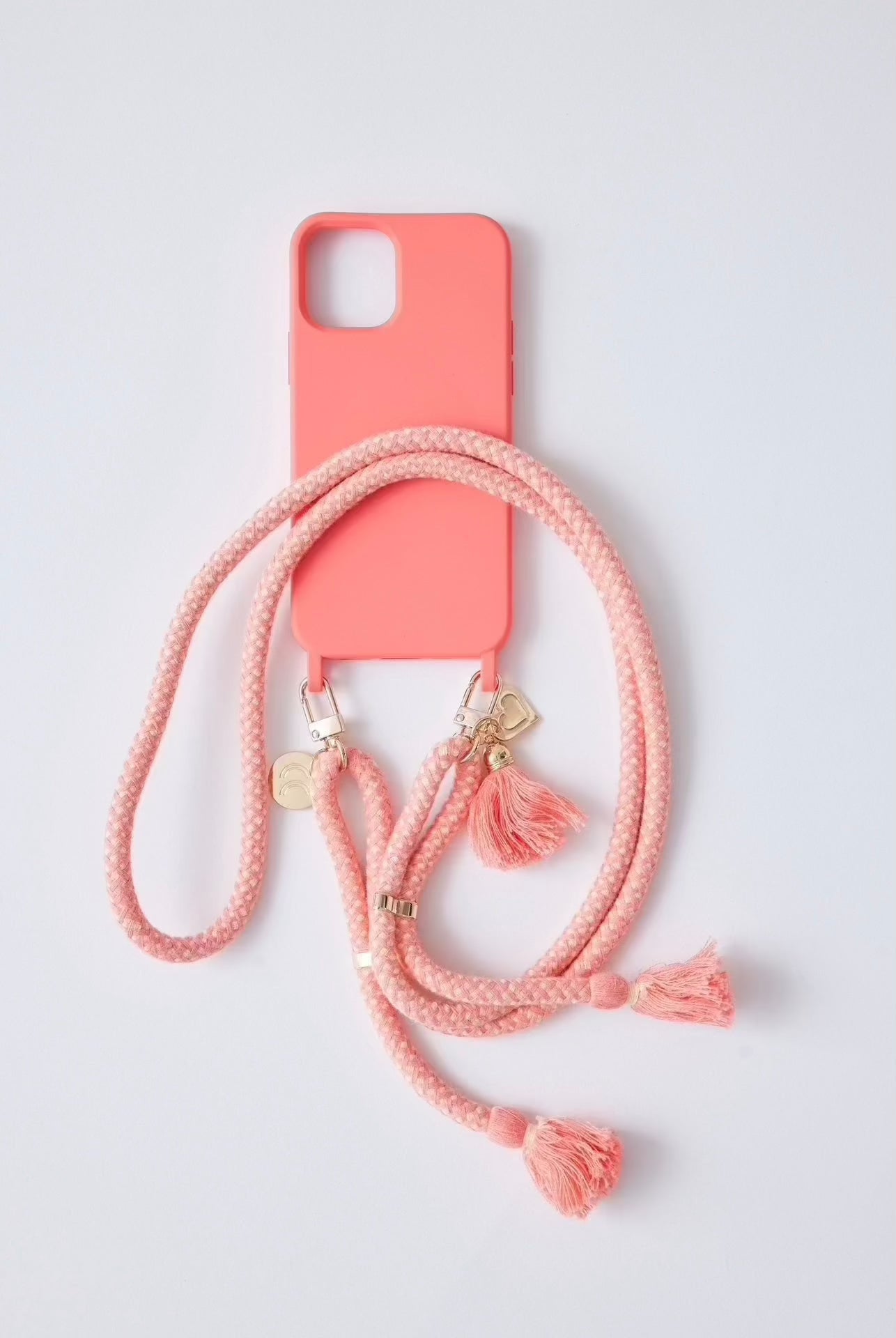Colorful phone case with detachable strap for IP 15 series.