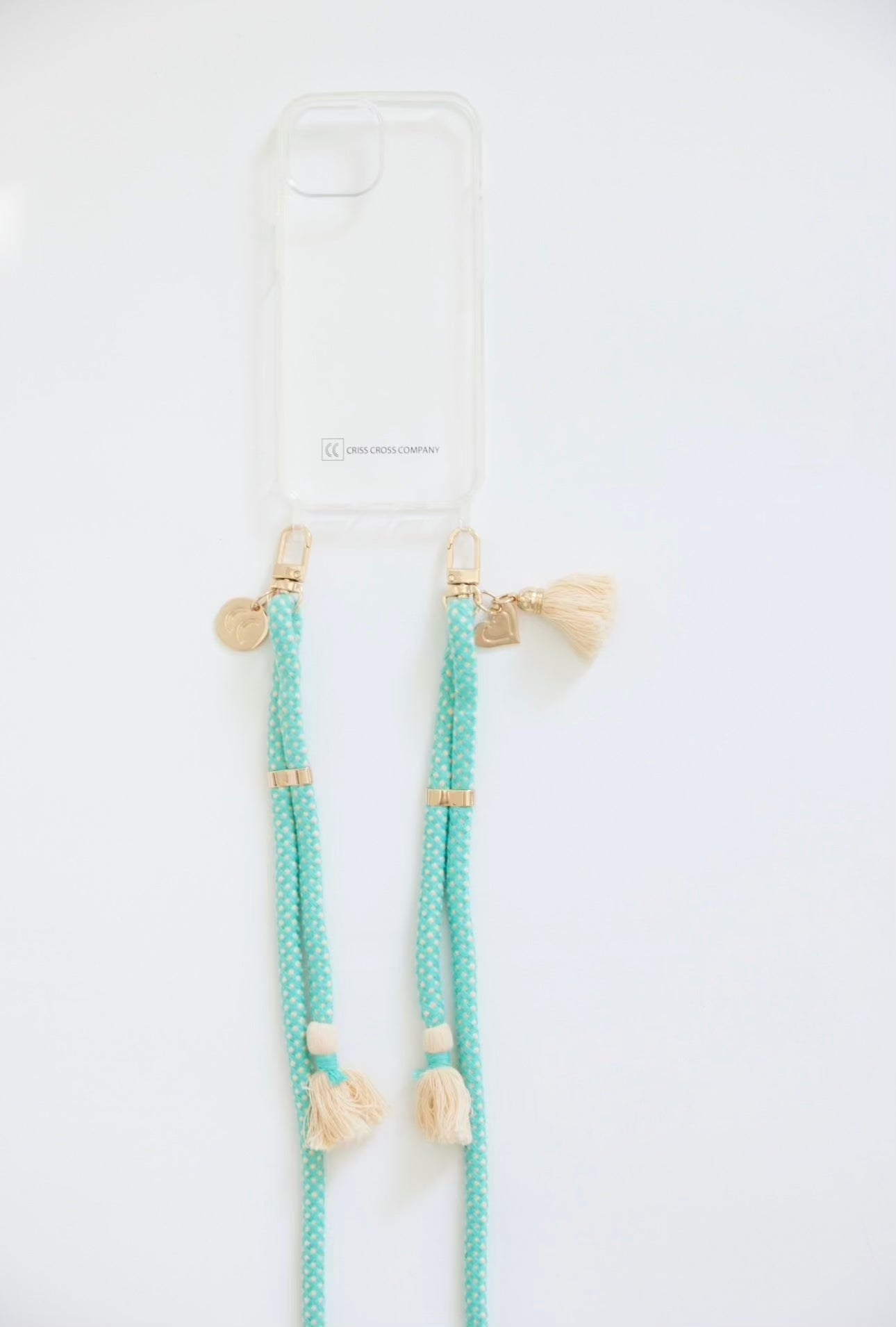 Clear case with turquoise strap bundle featuring tassels.