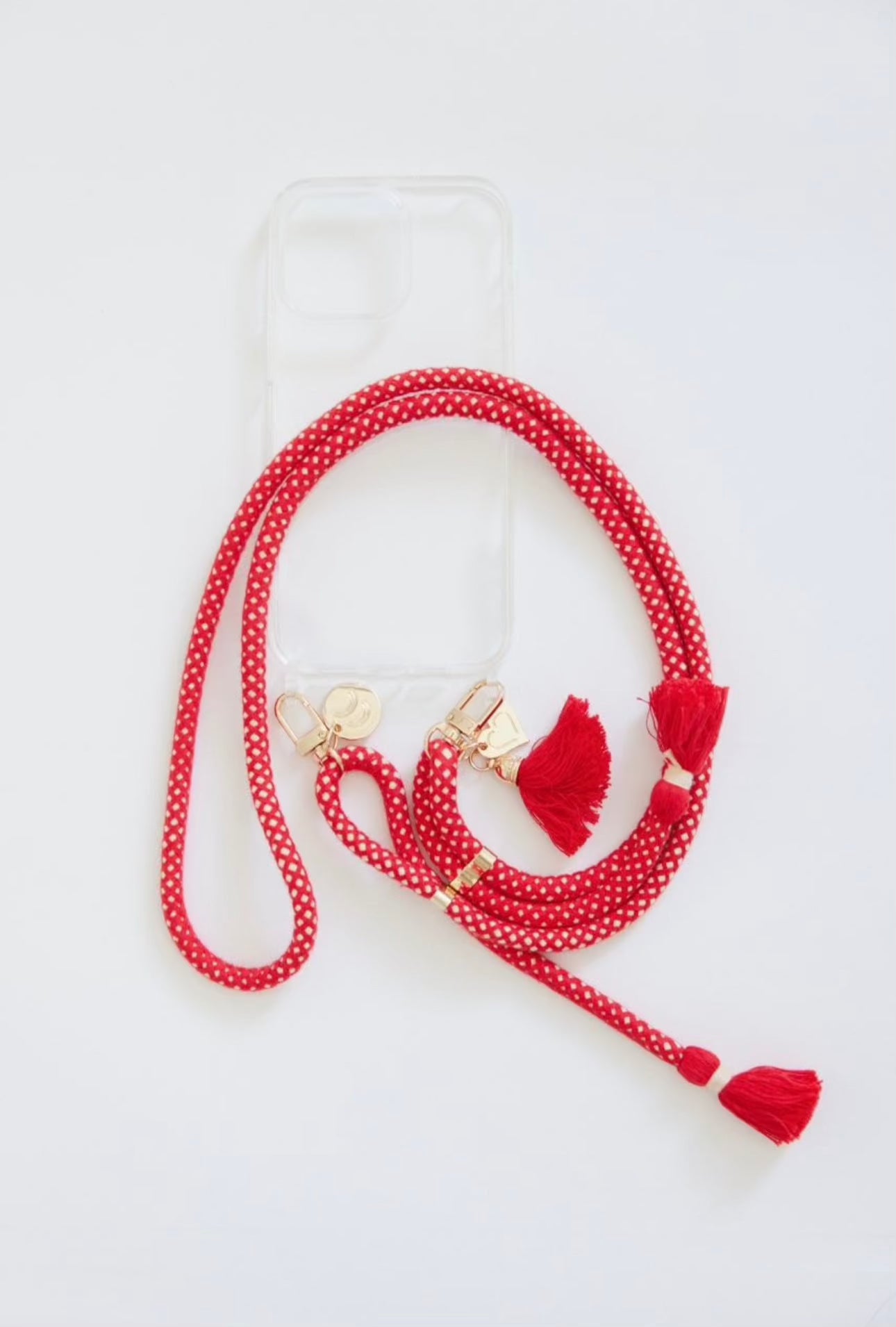 Bundles - Clear Cases with Straps featuring a red tassel strap.