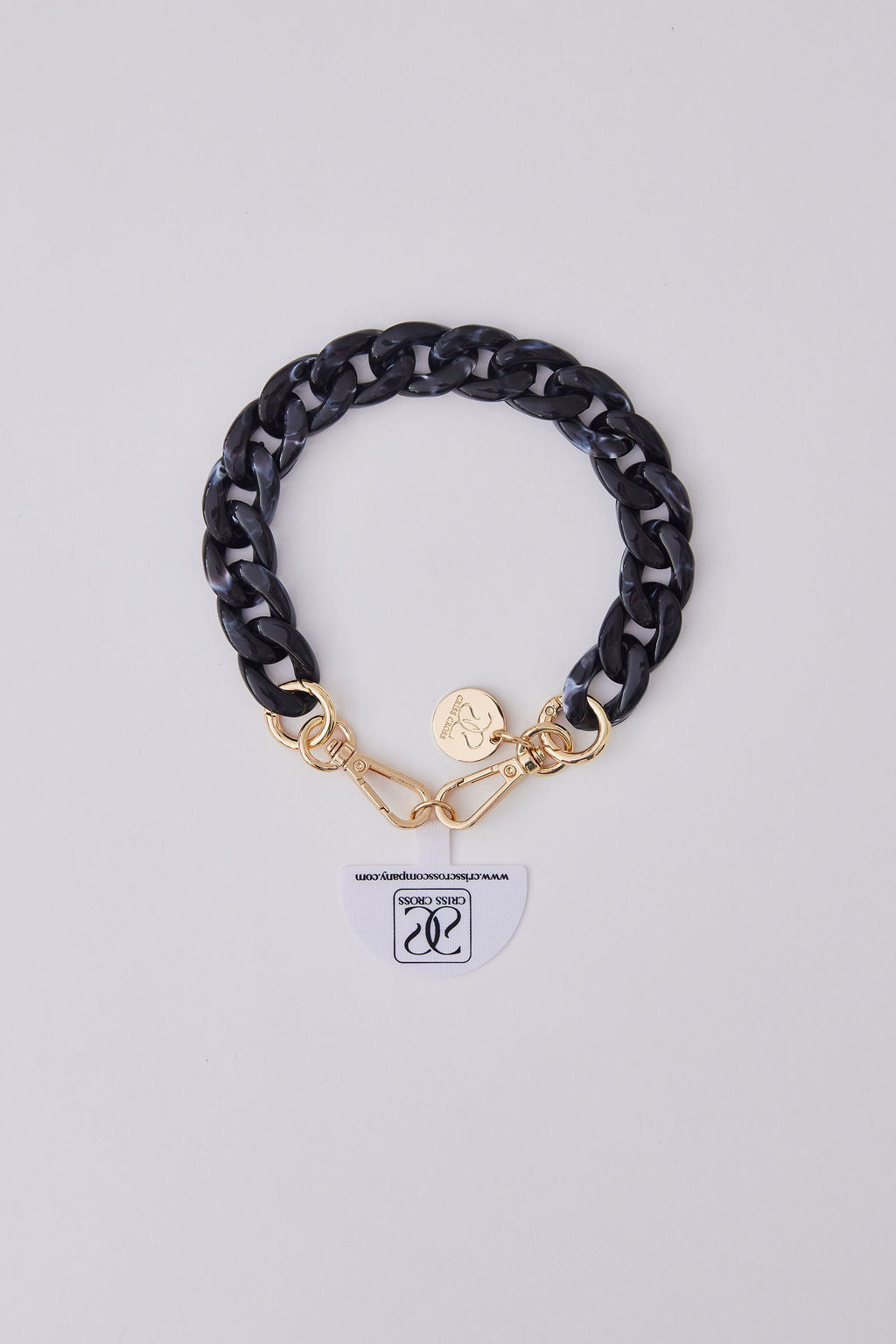 Black acrylic detachable phone wristlet with gold clasps and charm