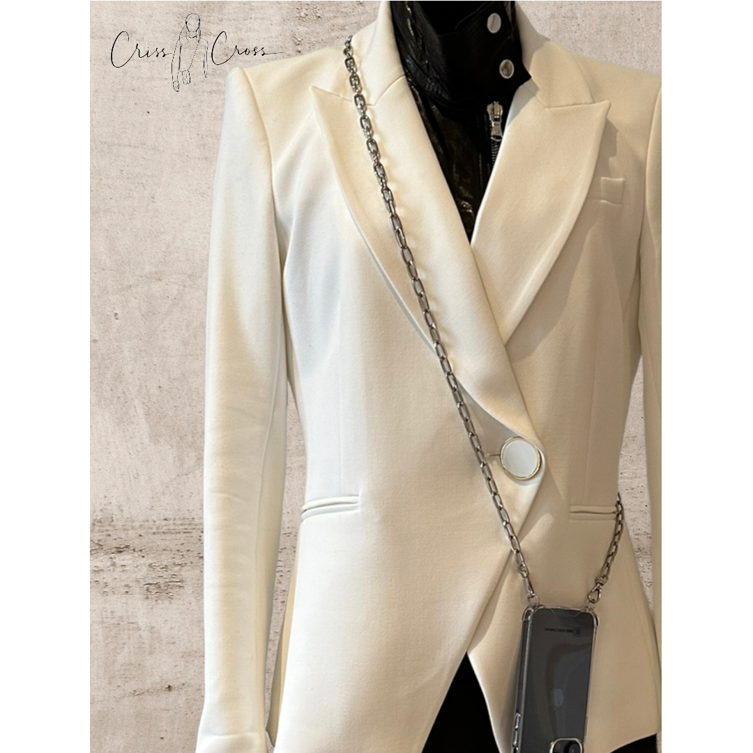 Detachable silver phone chain Sam hanging on a white blazer for hands-free style.
