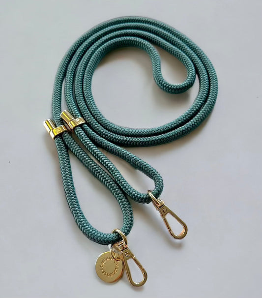 Detachable poly straps in green with gold carabiners, adjustable 60-inch polyester.
