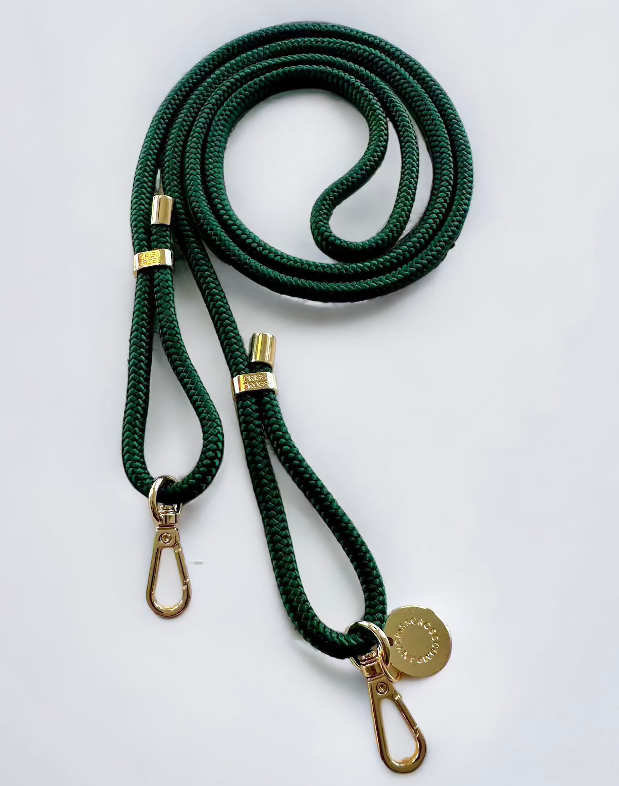 Detachable green poly straps with gold carabiners adjustable to 60 inches.