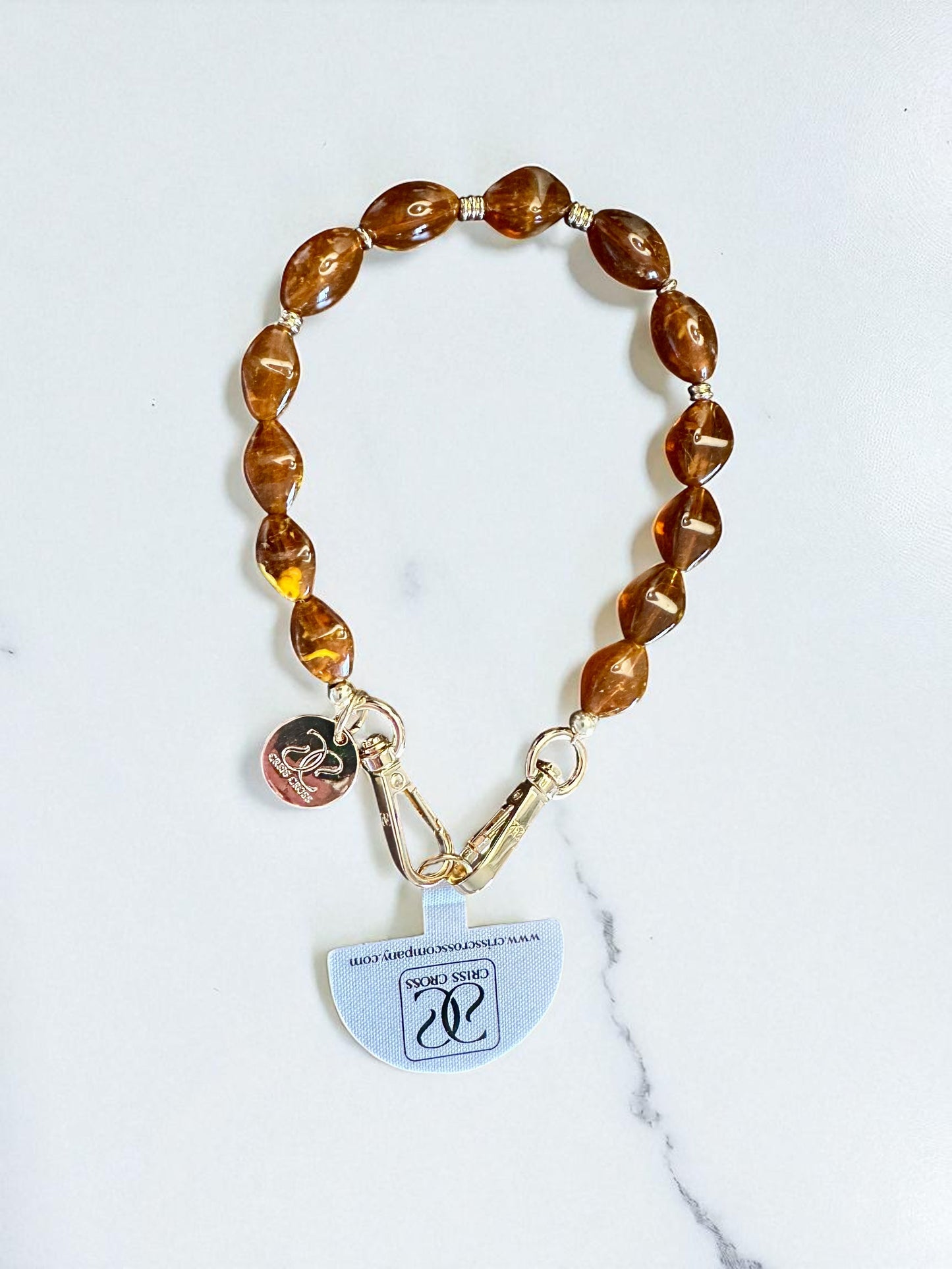 Detachable beaded wristlet with brown beads and gold clasps for phone attachment, 12-inch length