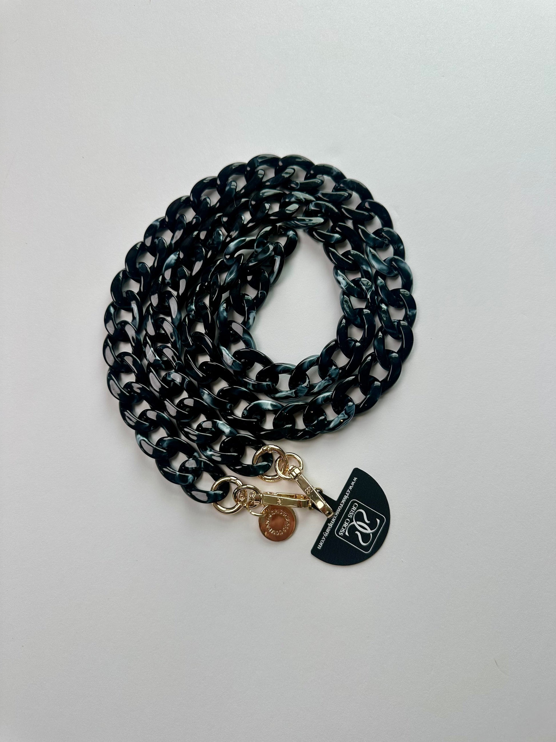 Glossy detachable acrylic phone chain with universal adapter and alloy carabiners attached to phone case