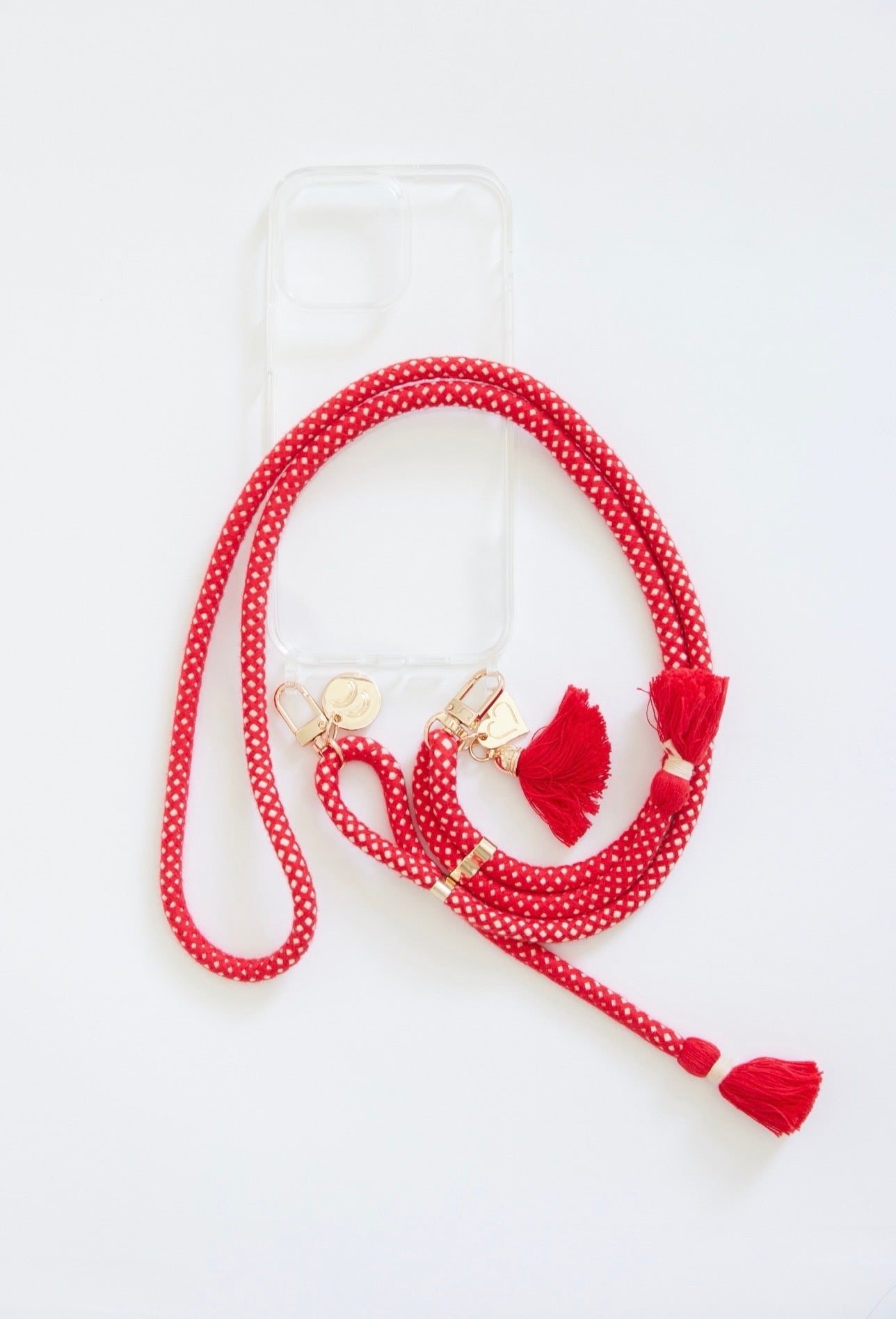 Detachable cotton phone straps with double carabiners, tassels, and heart charm in gold and silver hardware