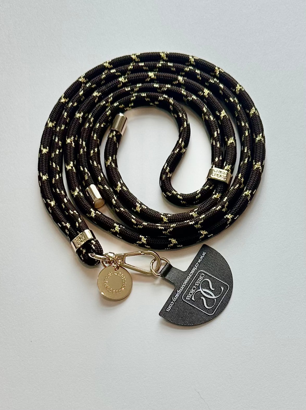 Goldline Phone Straps durable woven design with gold thread and universal adapter attached to smartphone