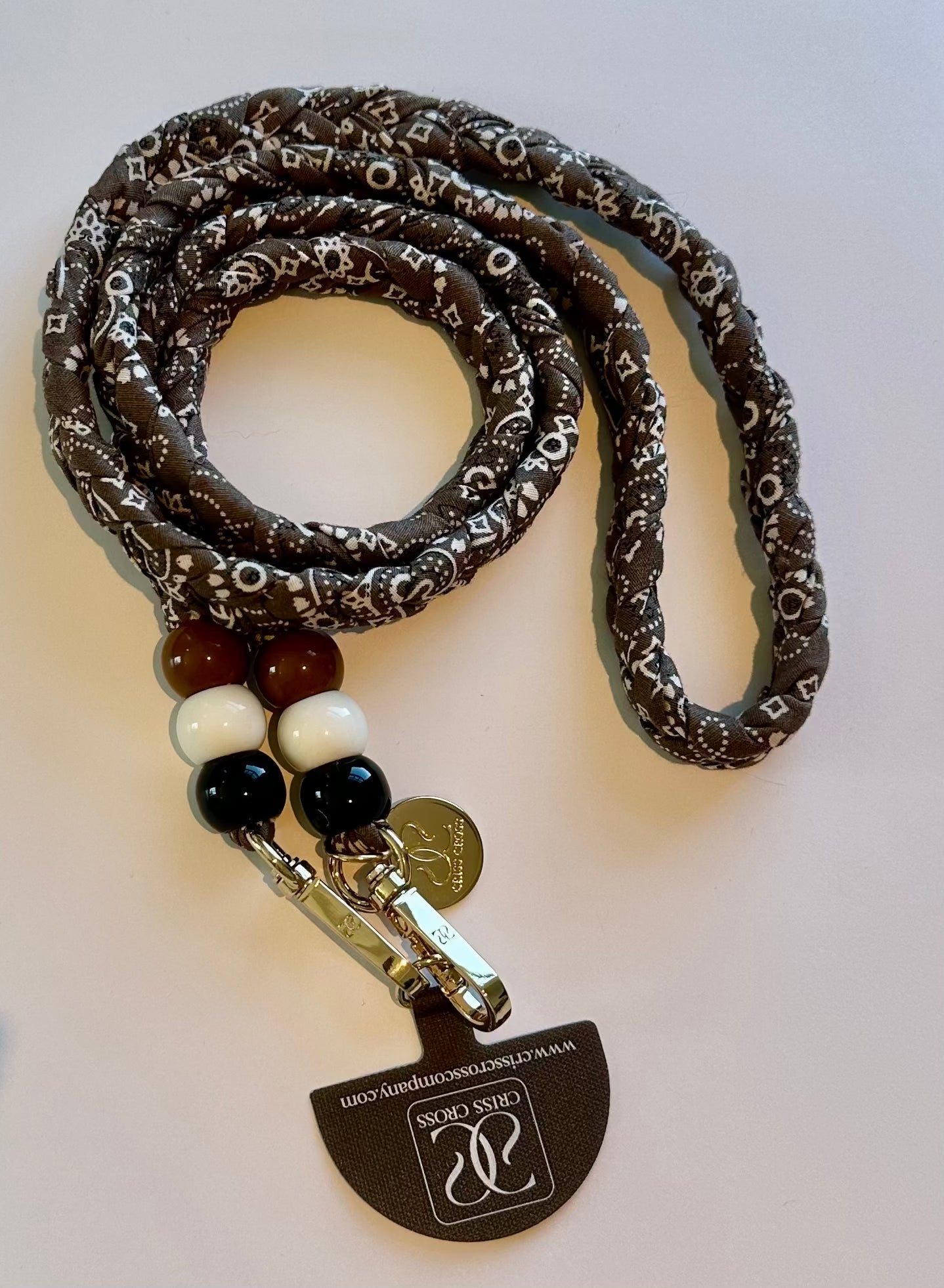 Bandana phone strap with beads and universal adapter attached to smartphone