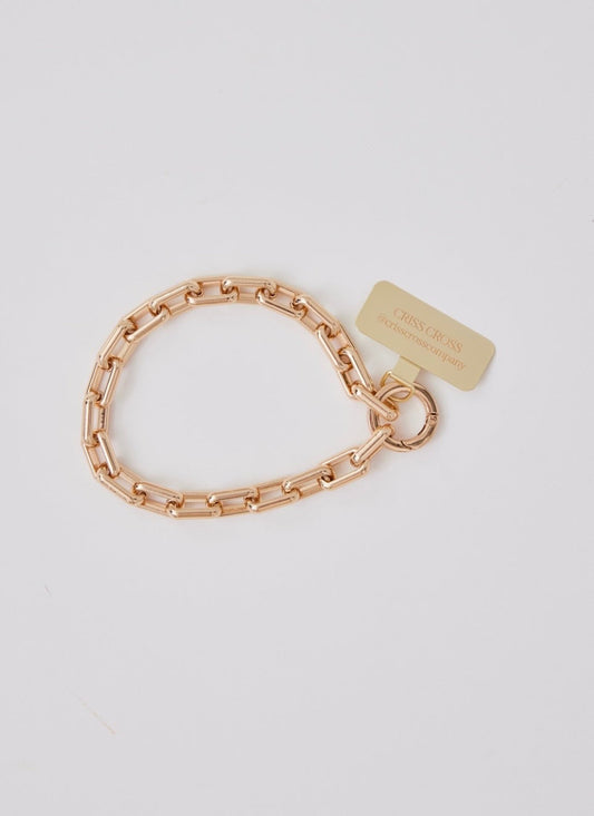Gold Wristlet Ava phone accessory with universal adapter and gold-tone alloy design