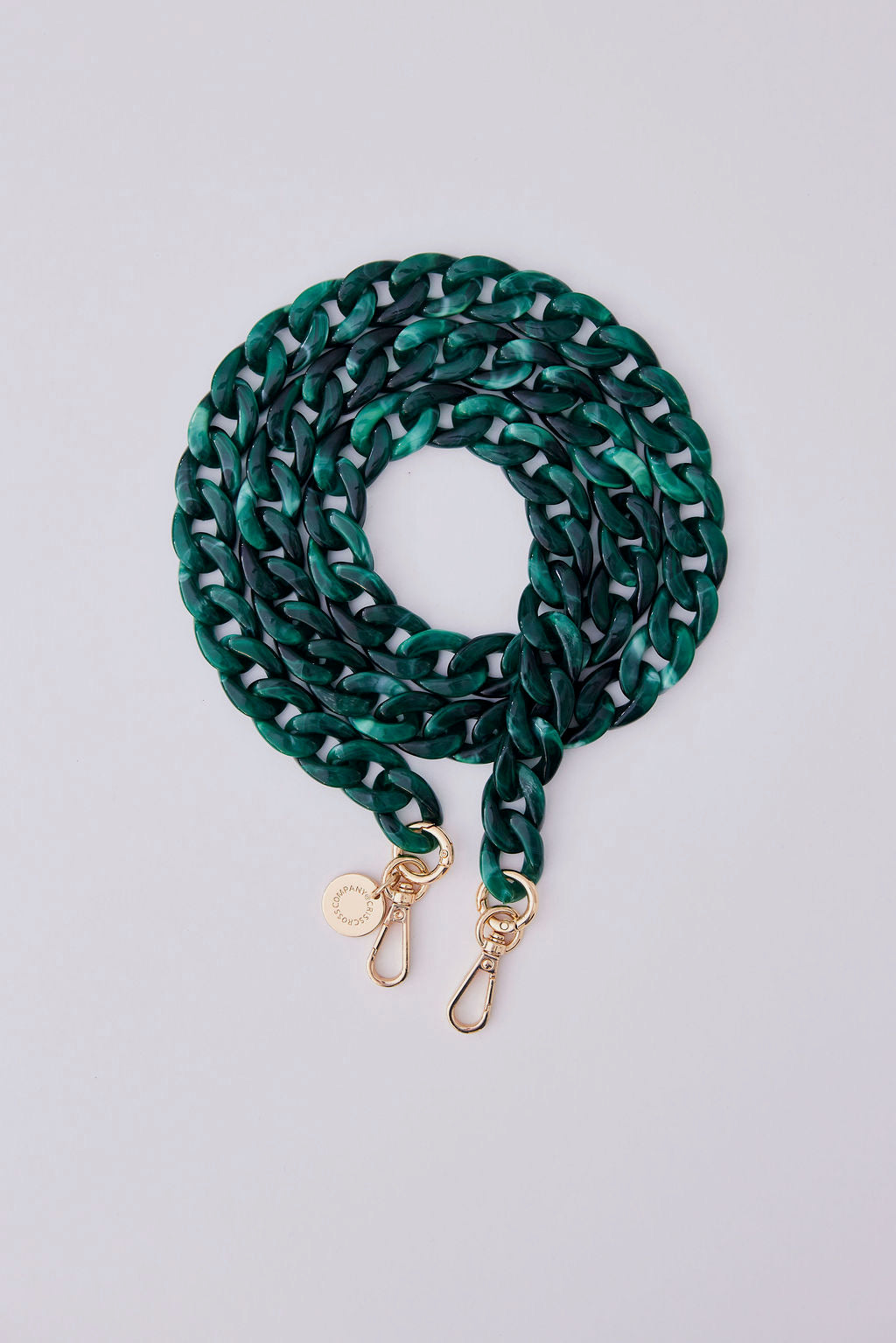 Detachable acrylic phone chain in green with gold rings and carabiners for stylish phone accessory