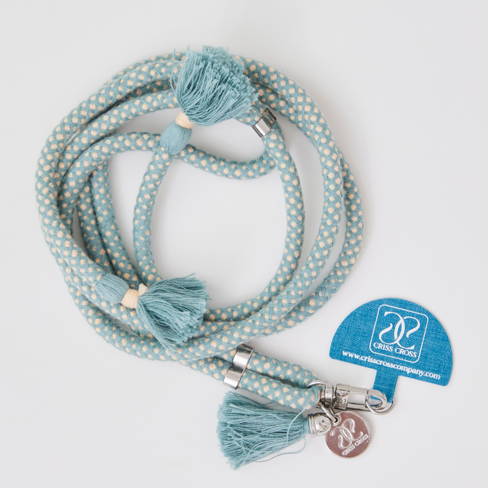 Adjustable cotton phone strap with universal adapter and decorative tassels for hands-free carrying