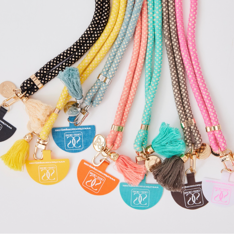 Adjustable cotton phone strap with universal phone adapter and decorative tassels for hands-free carrying