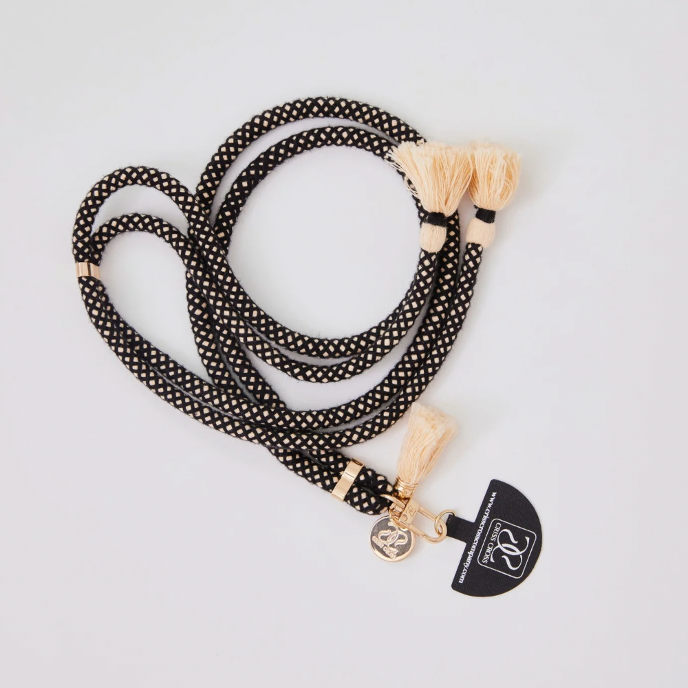 Adjustable cotton phone strap with universal phone adapter and decorative tassels for hands-free carrying