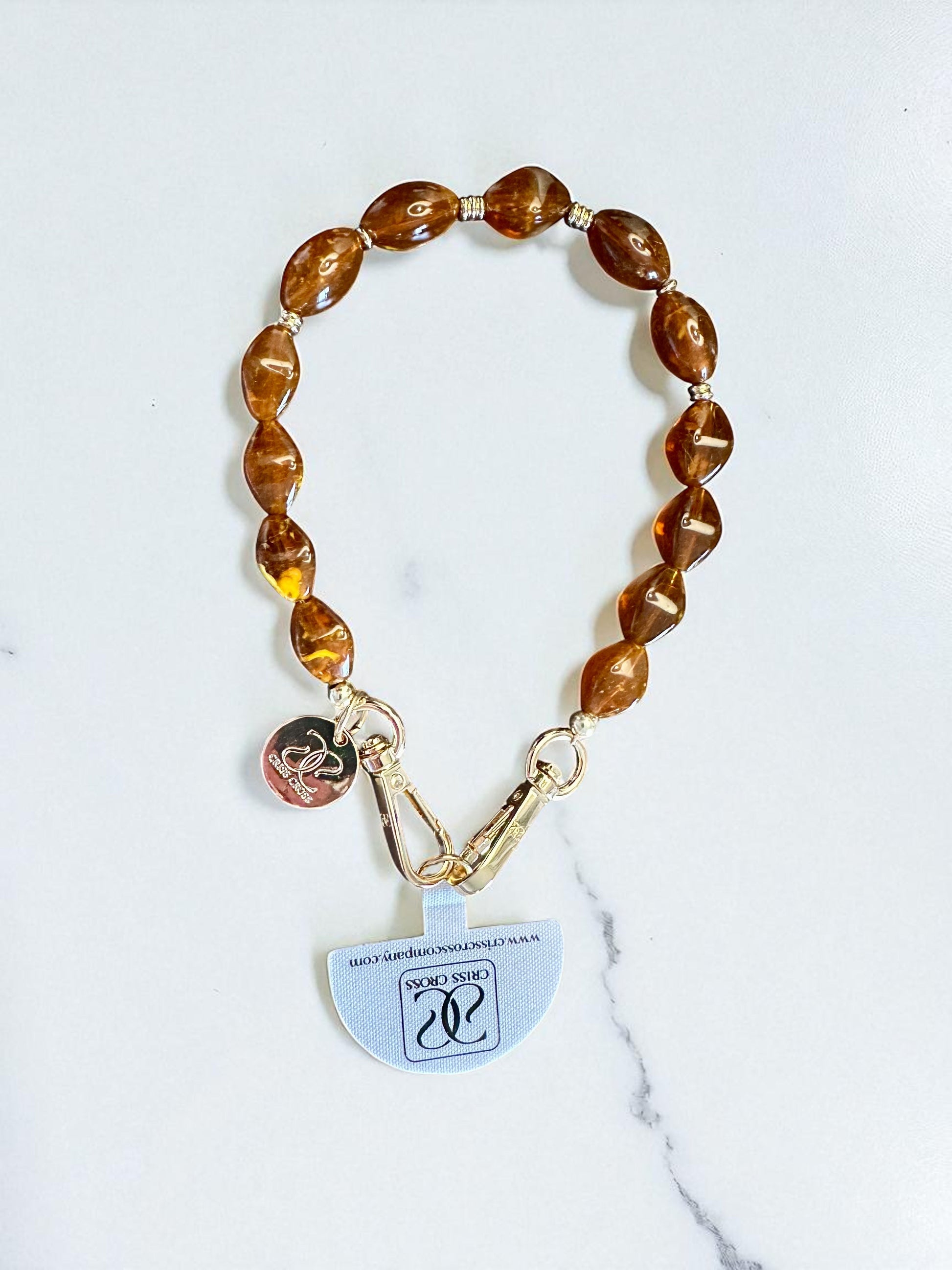Detachable beaded wristlet with brown beads and gold clasps for phone attachment, 12-inch length