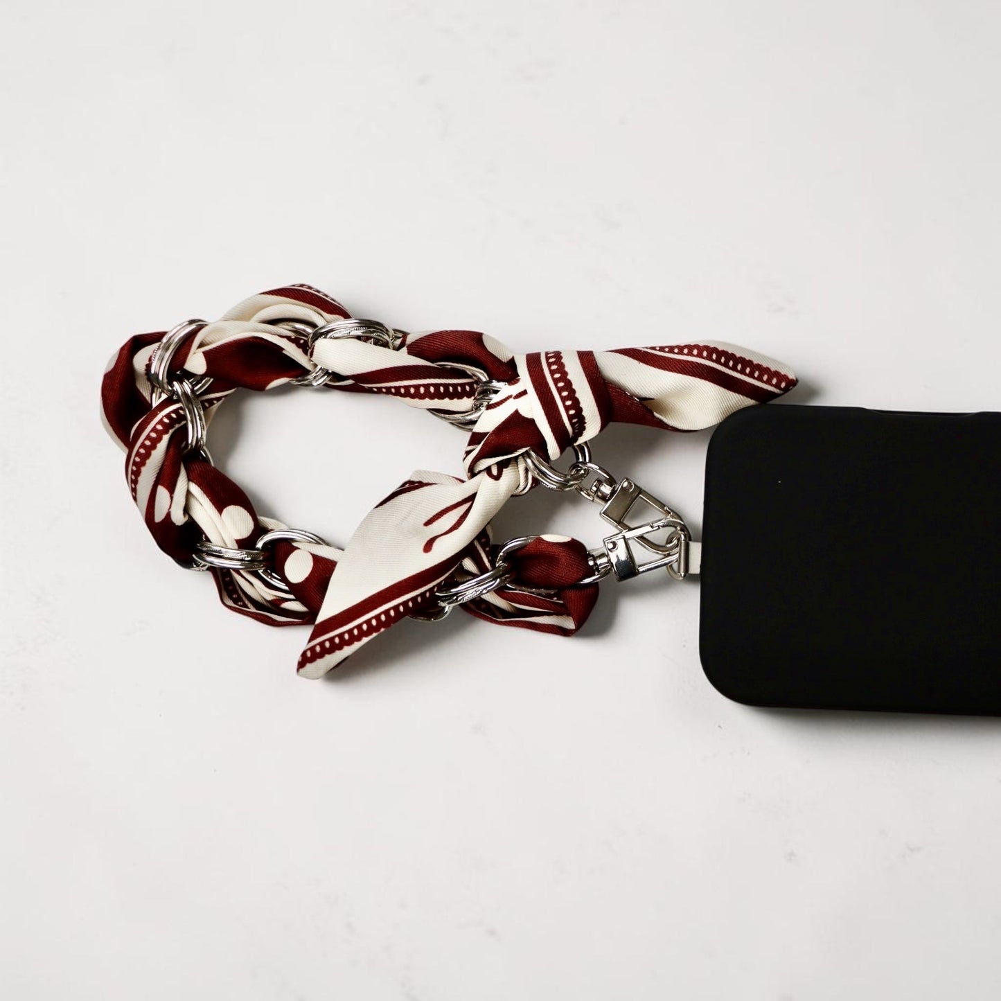 Paris-inspired dotted scarf phone wristlet with adapter and carabiner for hands-free carry